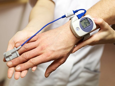 Sleep expert examining a patient’s sleep apnea vitals