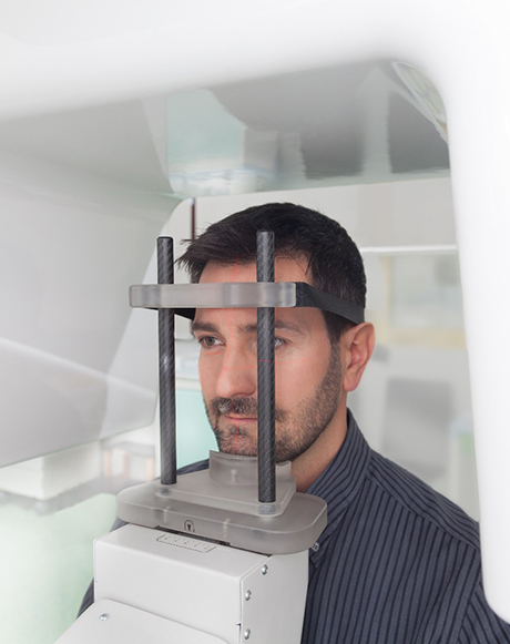 patient standing in CBCT scanner