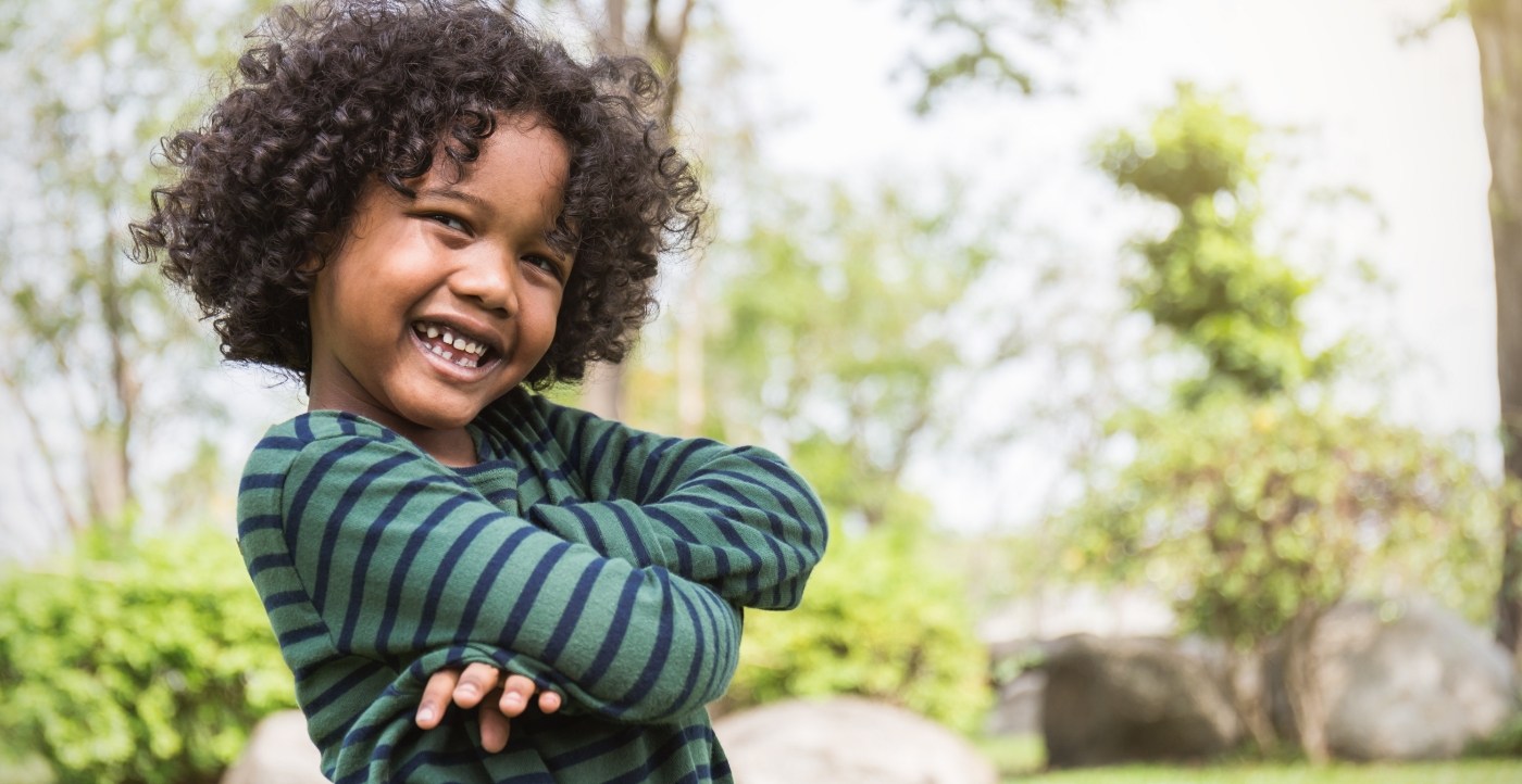 Child smiling after children's dentistry visit