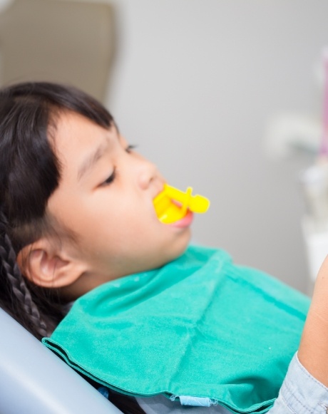 Child receiving fluoride treatment