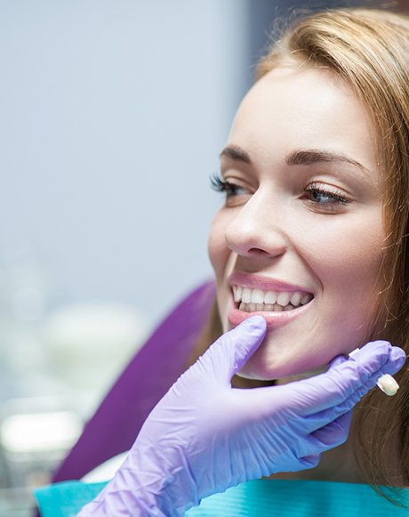 woman having her teeth examined by dentist in Huntsville 
