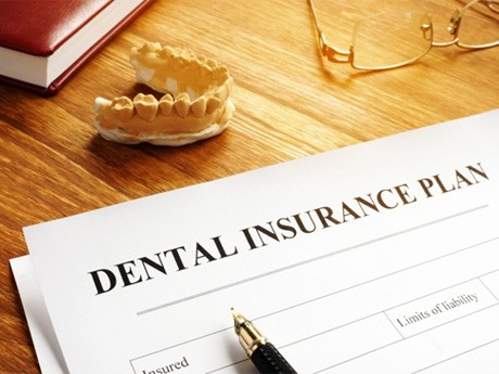 Dental insurance paperwork in Huntsville