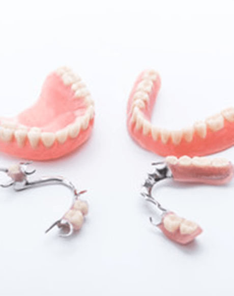 Full and partial dentures lying on a table