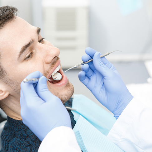 a patient visiting an emergency dentist in Huntsville