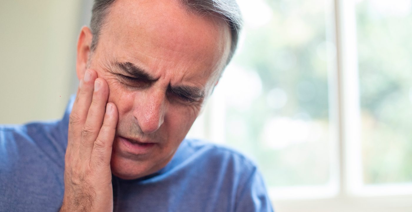 Man in pain before emergency dentistry