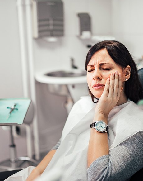 Female dental patient suffering from tooth pain