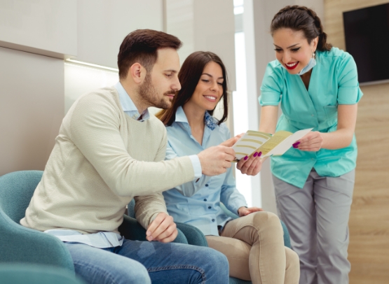 Dental team member discussing dental insurance options with patient