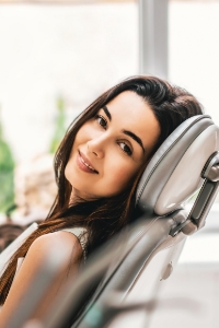 Woman in dental chair smiling