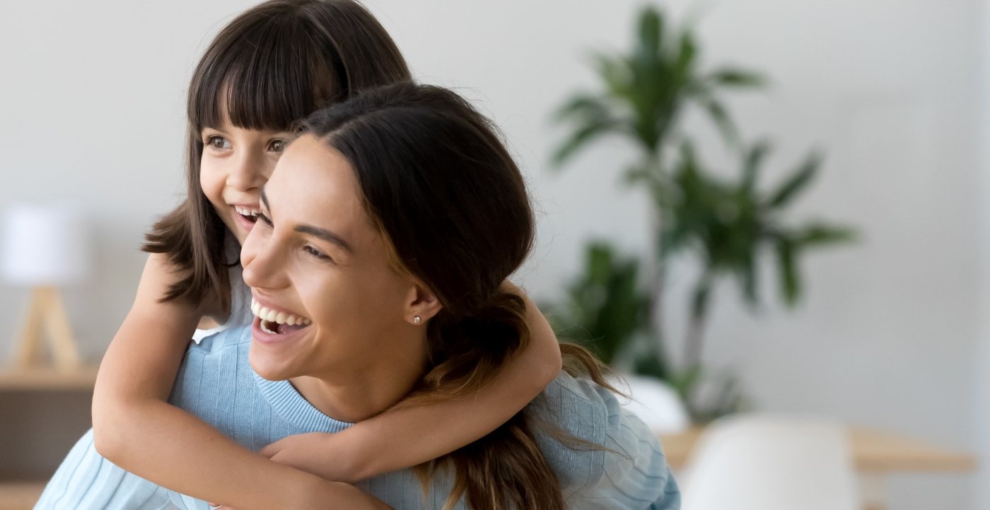 Mother and child sharing healthy smiles thanks to preventive dentistry