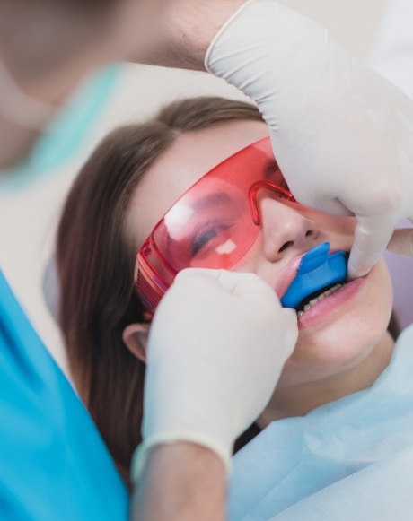 Dental patient receiving fluoride treatment