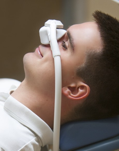 Dental patient receiving nitrous oxide dental sedation treatment