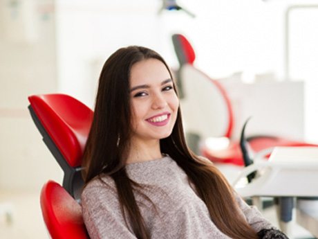 A smiling woman at the dentist’s office  