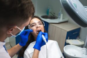 Dentist working on young patient.