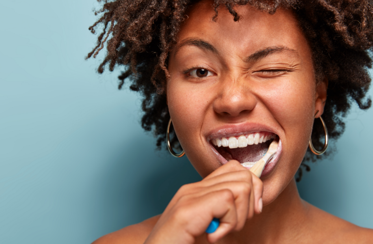 Woman brushing teeth